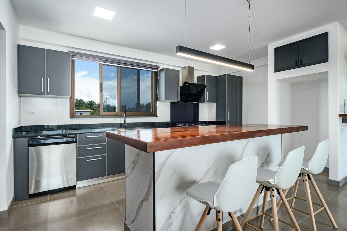 CBV10 kitchen with timber-topped island and bar stools
