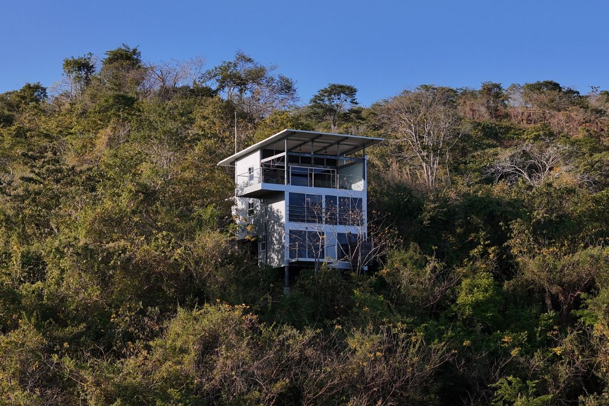 FRESH home by Gatun Lake Construction on a forested hillside in Cambutal, Azuero