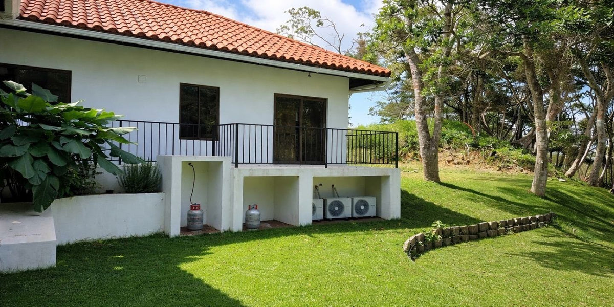 Side of Yuma 44 with covered terrace and garden