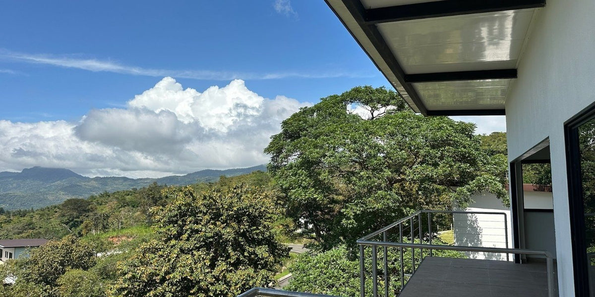 View over the forest and mountains from a Yuma 48 balcony